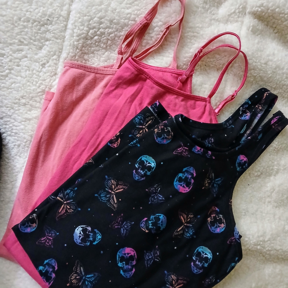 Pink and Black Bodysuits with Sleek Design and Edgy Patterns